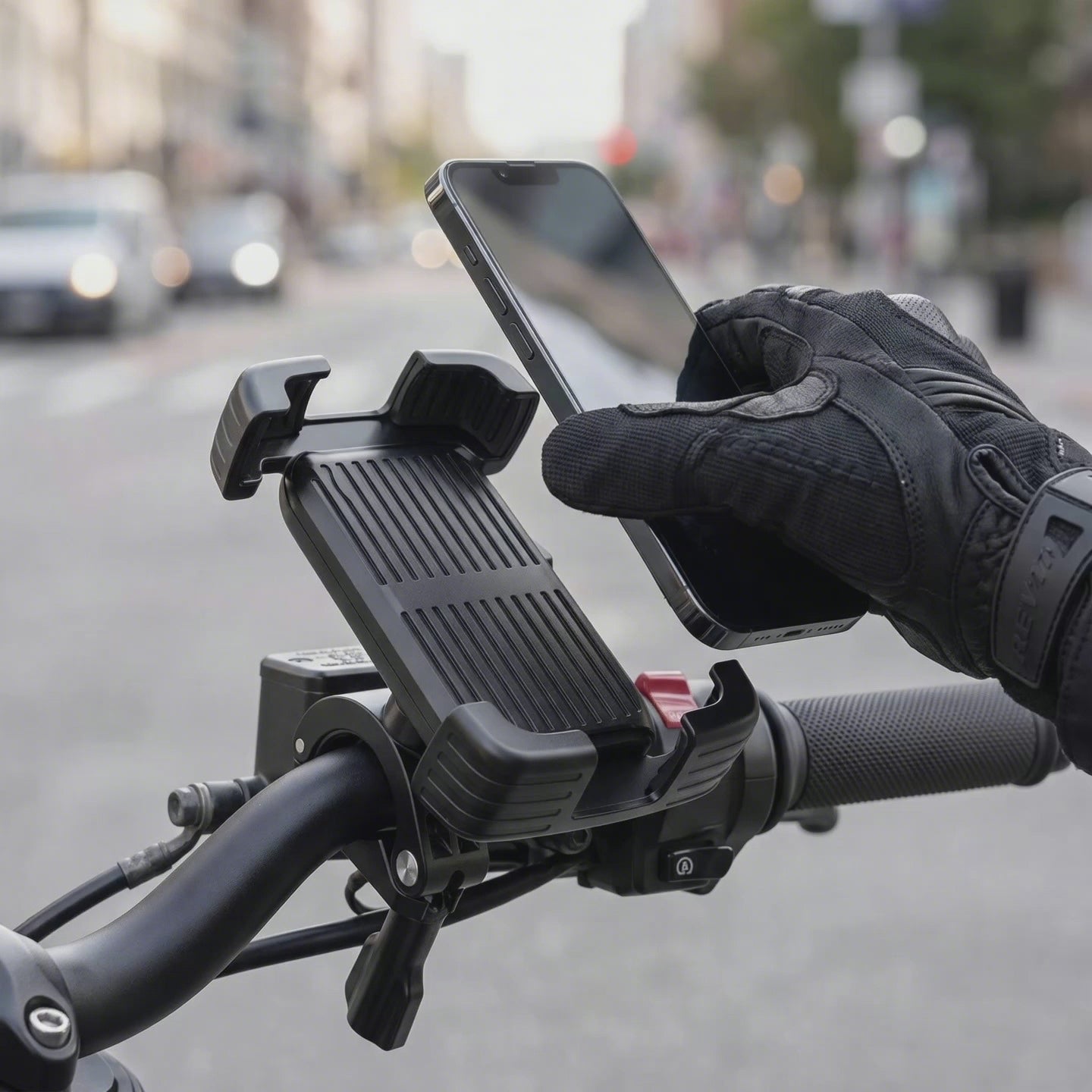Placing a phone into the Bastion Secure Grip mount — four-corner auto-lock demo